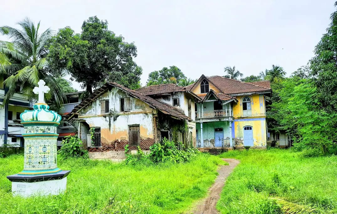 An old Portuguese-era house with a wayside cross in Vasai